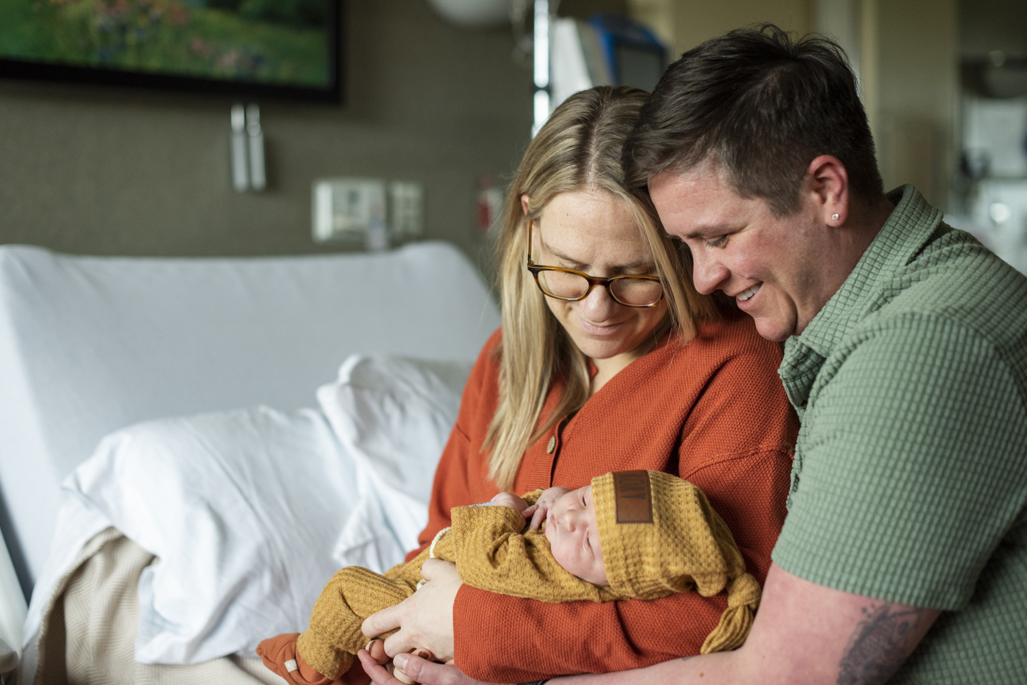 Parents holding baby at Hospital Newborn Photography in Asheville