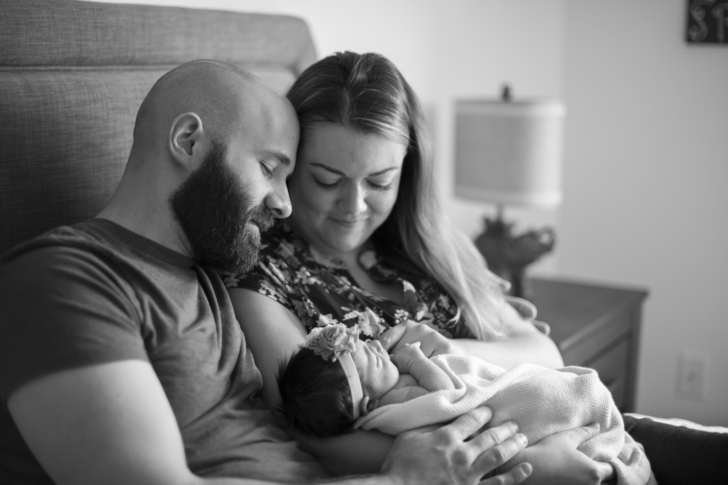 Parents holding baby girl during Newborn Photography in Asheville