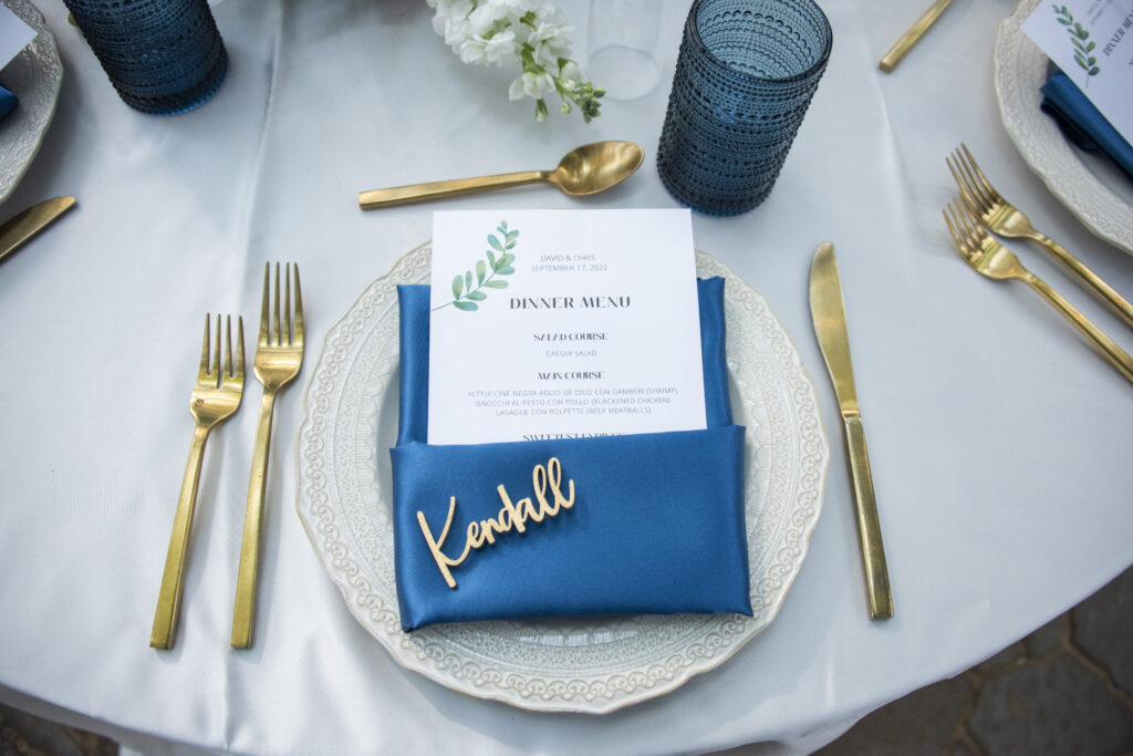 Blue and gold wedding place setting in Asheville, NC