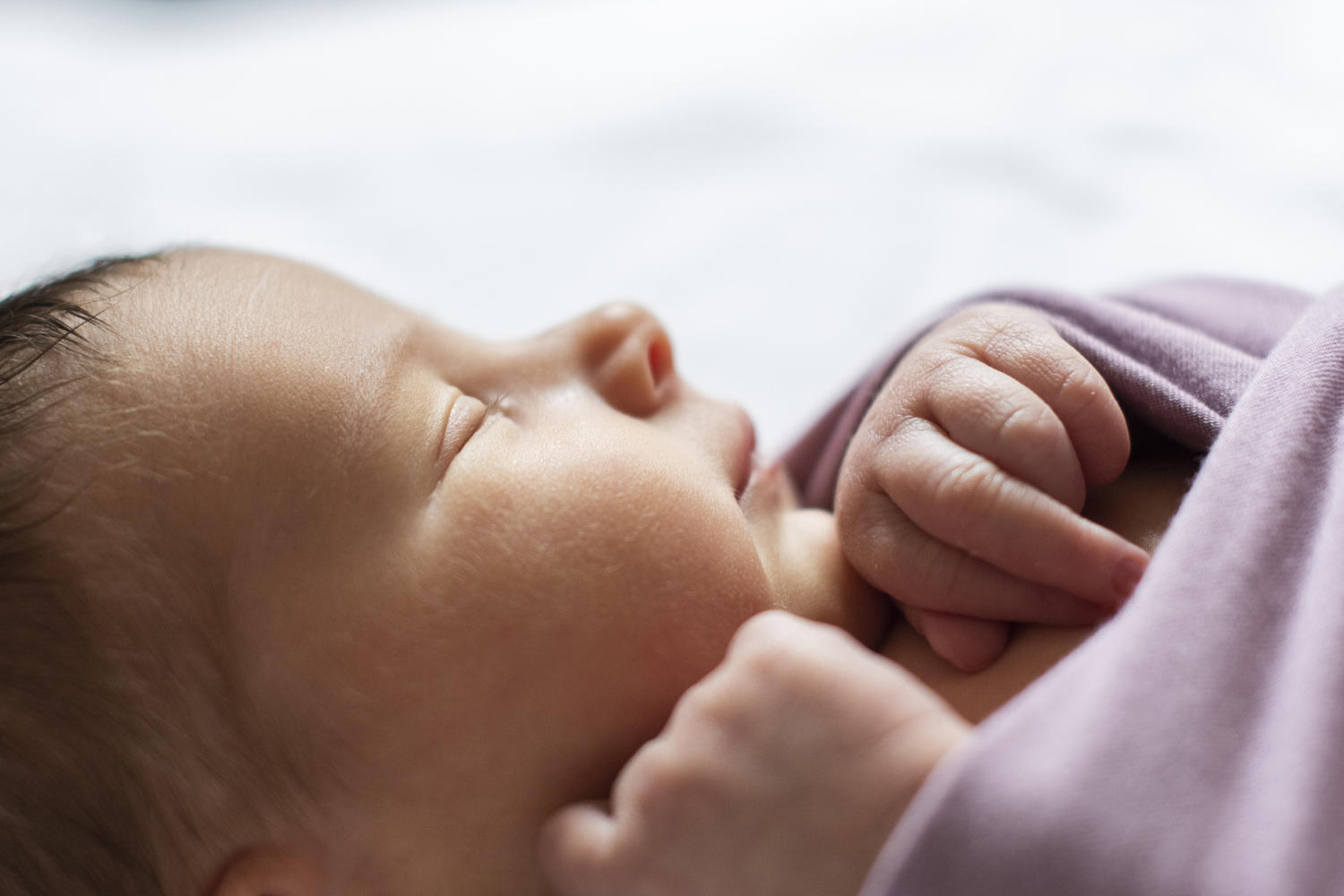 Profile of newborn baby girl