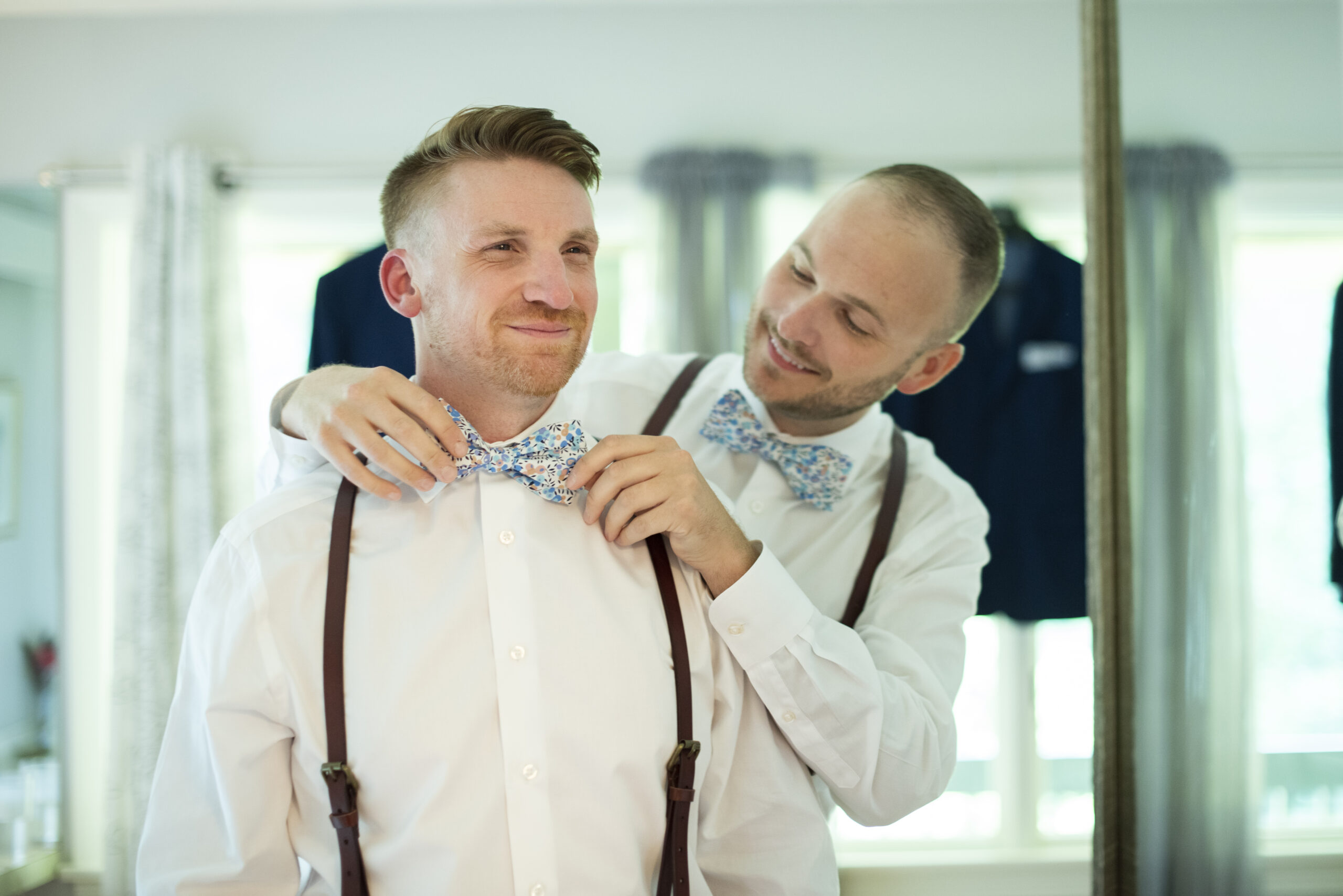 Queer couple getting ready together at Twisty Maple Wedding Photography in Asheville, NC
