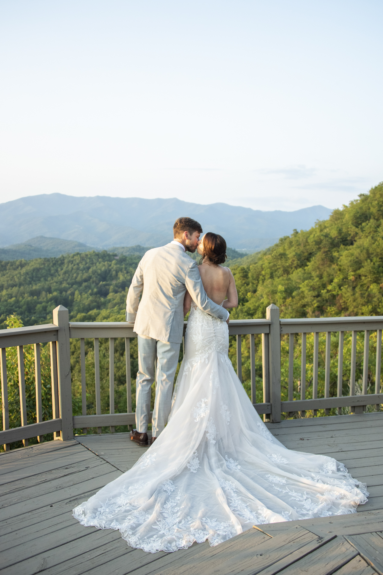 Couple kissing on mountain in Andrews, NC with Hawkesdene Wedding Photographer