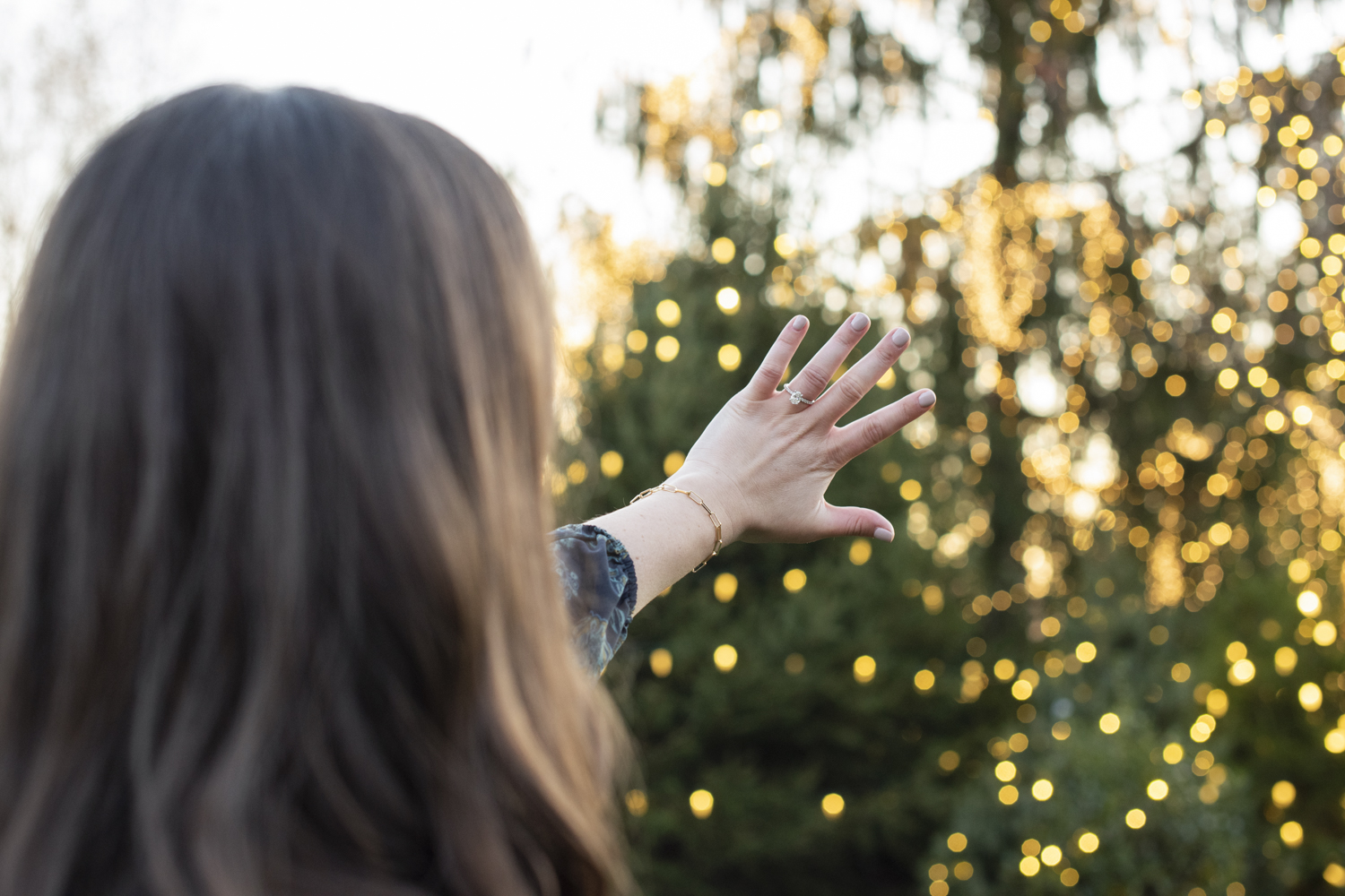 Woman showing engagement ring