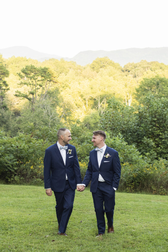 Gay couple walking with mountain view at Twisty Maple Wedding Photography