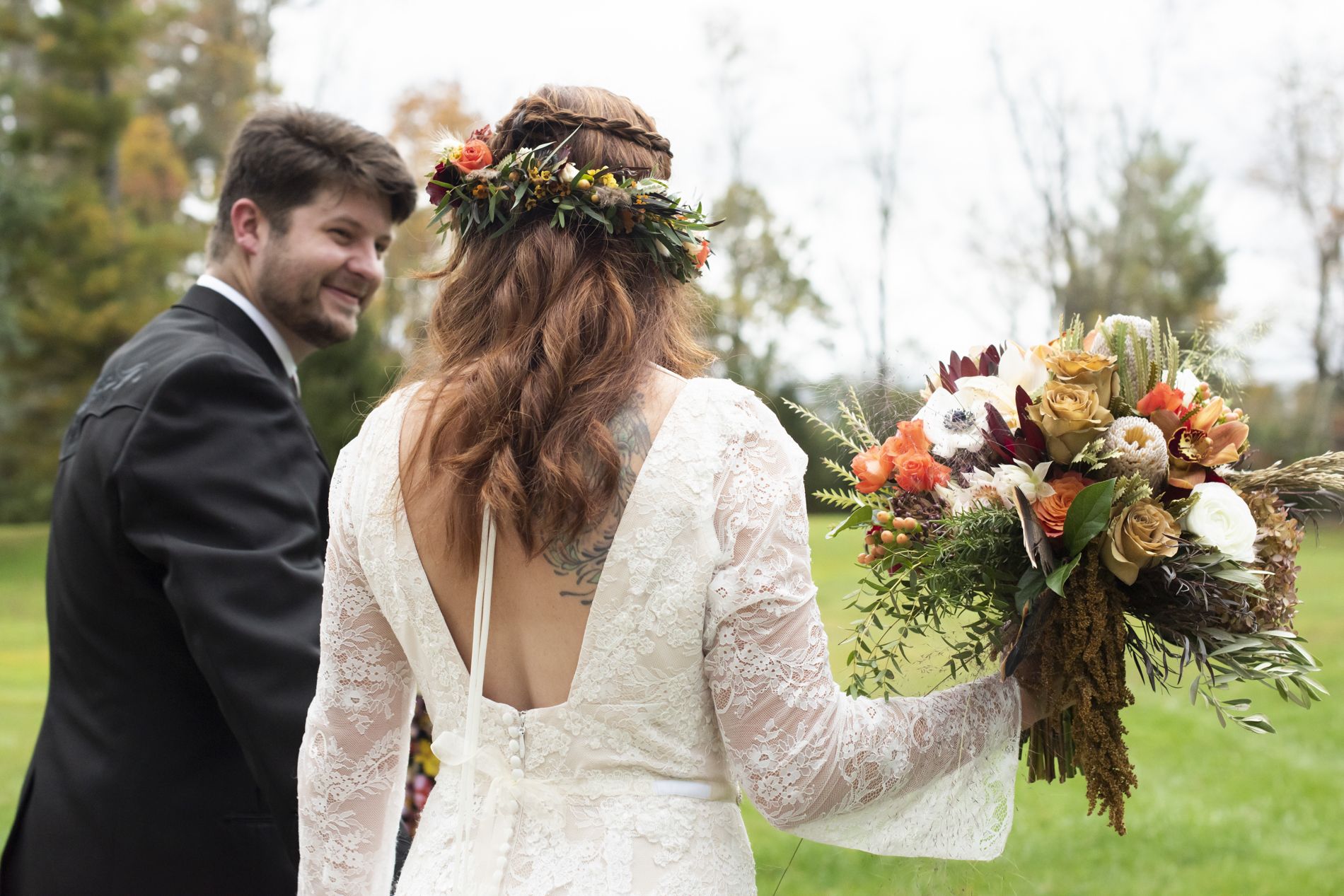 Couple walking away at fall wedding