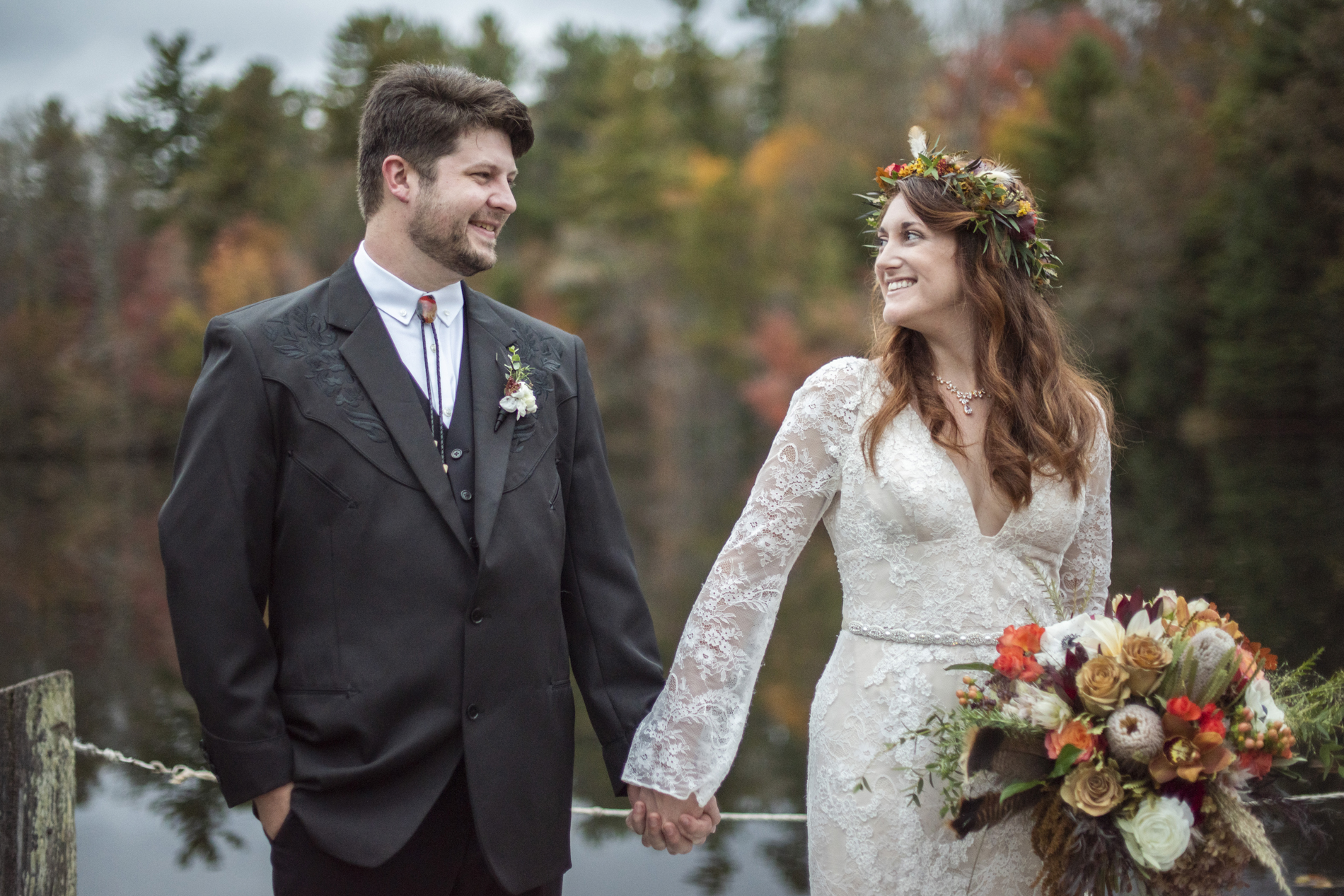 Highland Lake Inn wedding couple holding hands on dock