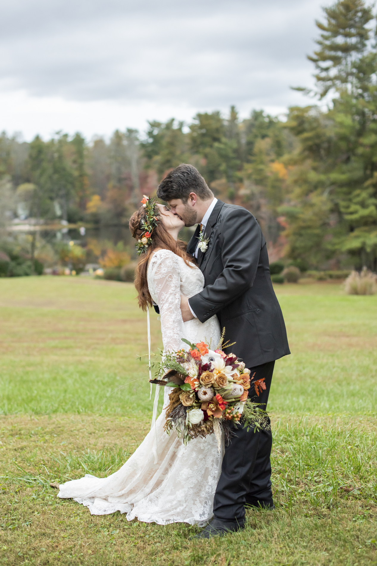 Couple kissing during wedding photos at Highland Lake Inn near Hendersonville