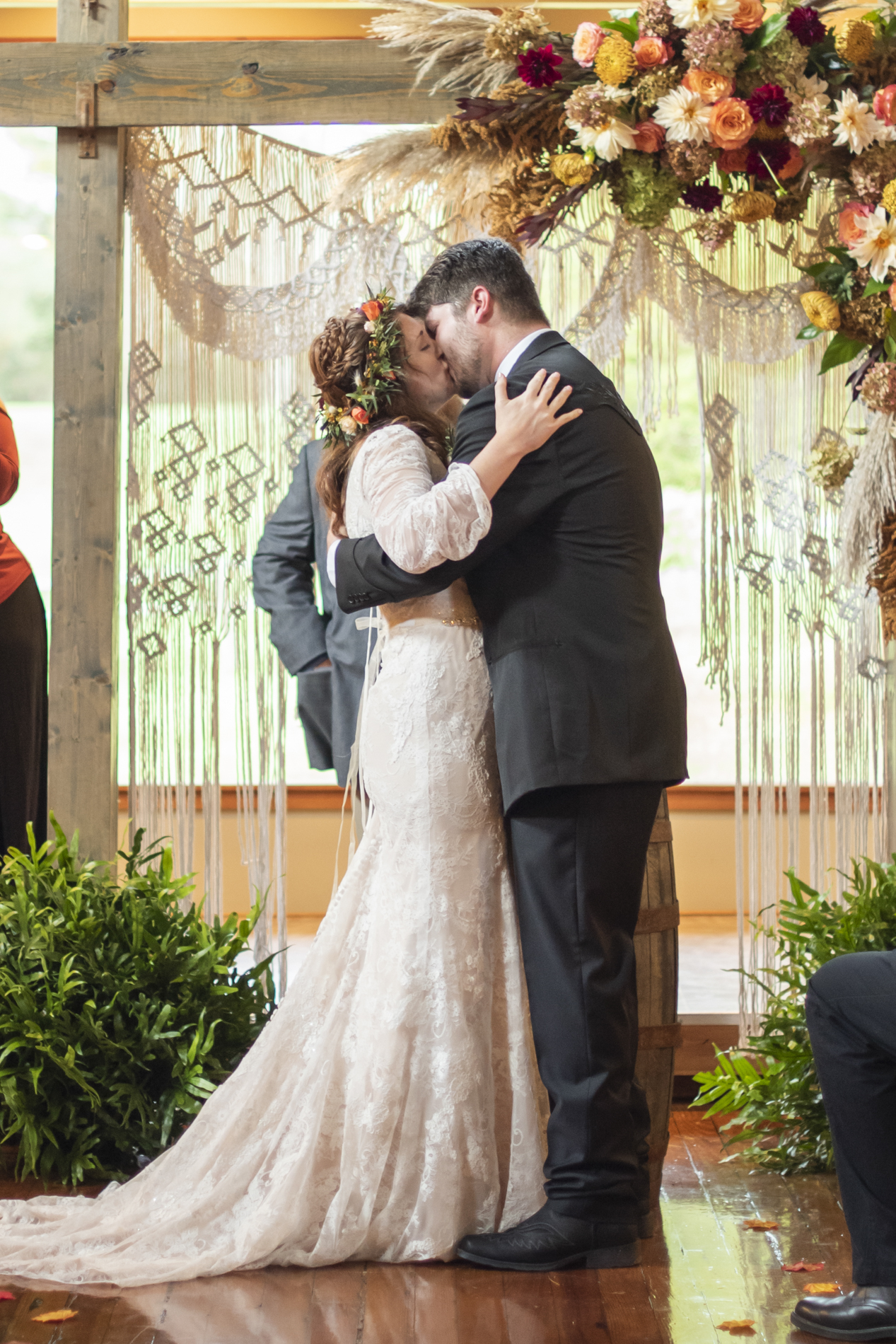 First kiss during fall wedding at Highland Lake Inn