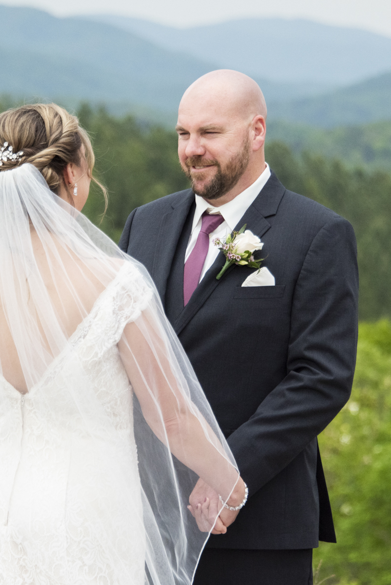 Groom smiling during wedding ceremony