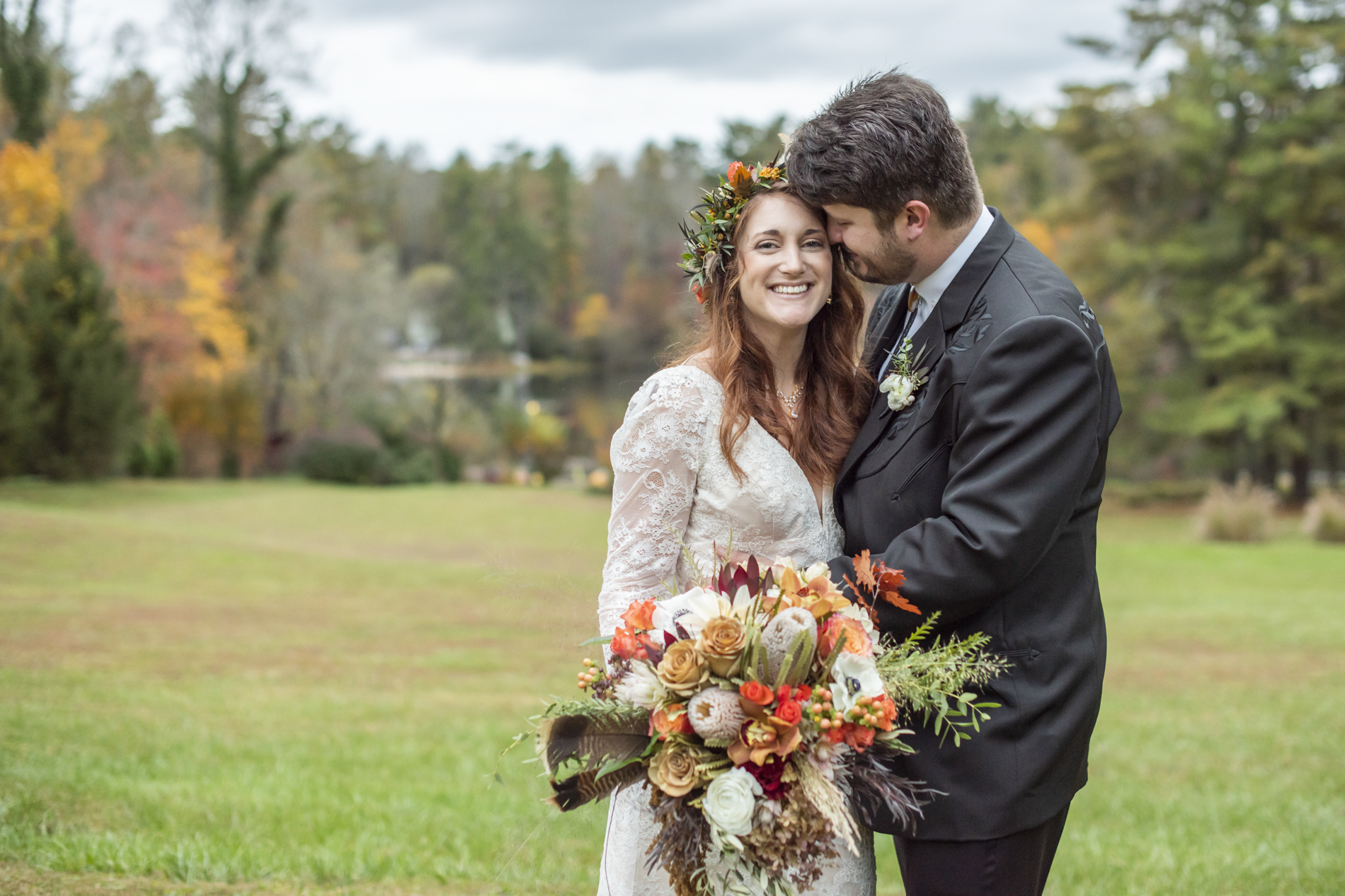 Bride smiling during fall wedding photos at Highland Lake Inn near Hendersonville NC