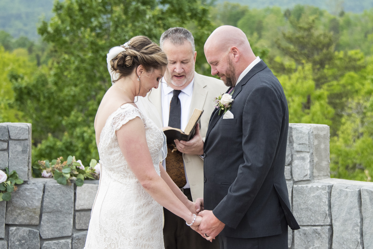 Couple praying during wedding ceremony