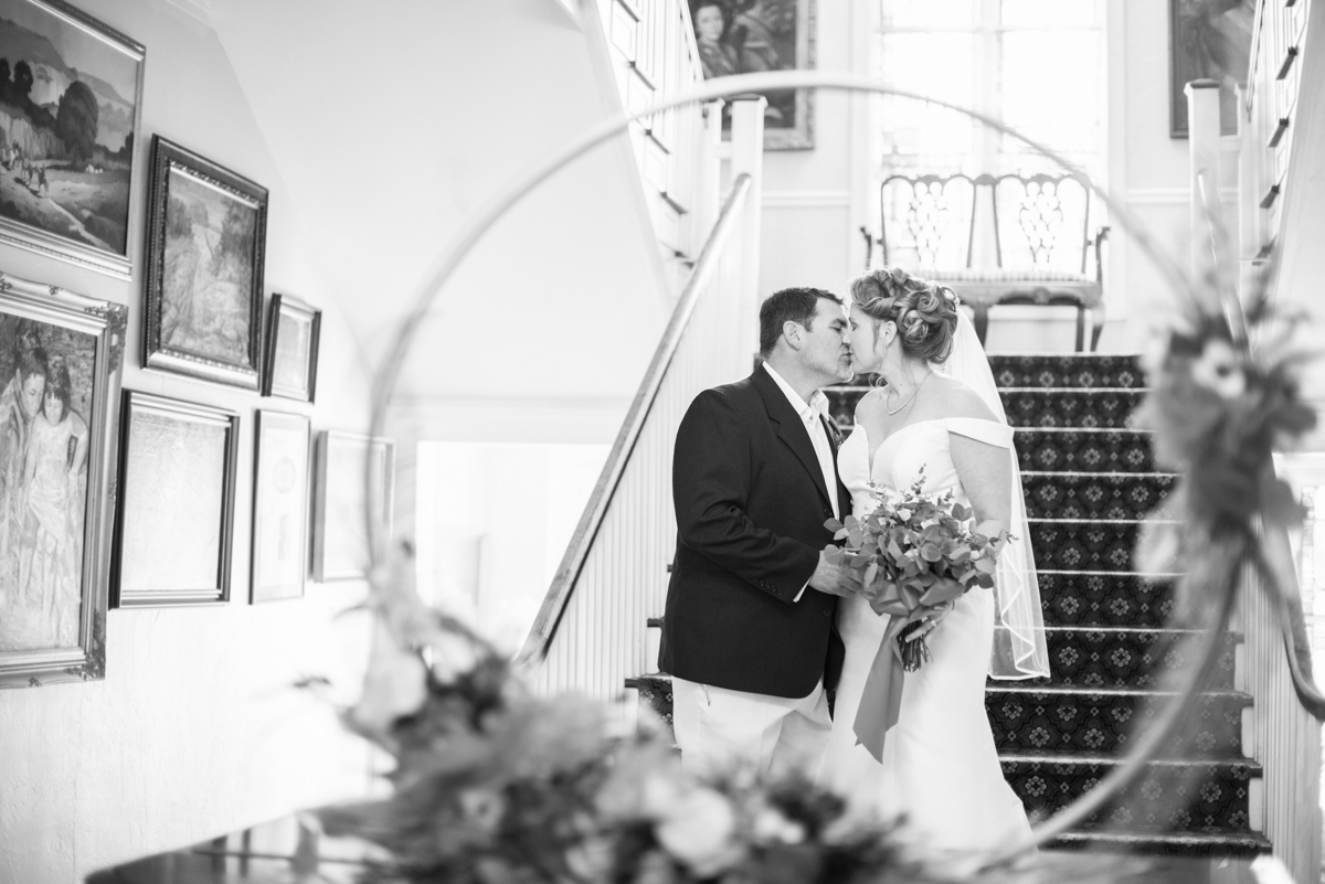 Couple kissing at historic inn wedding near Asheville NC