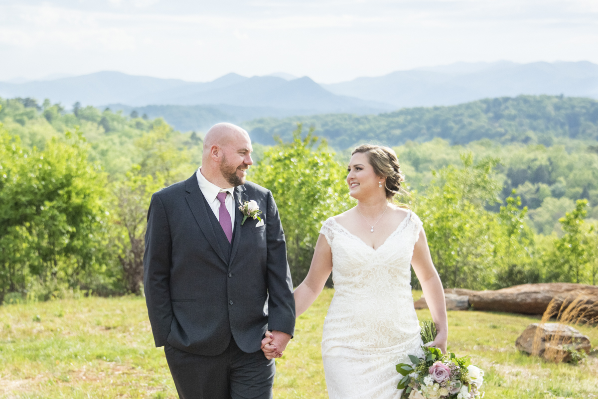 Couple walking with mountains behind