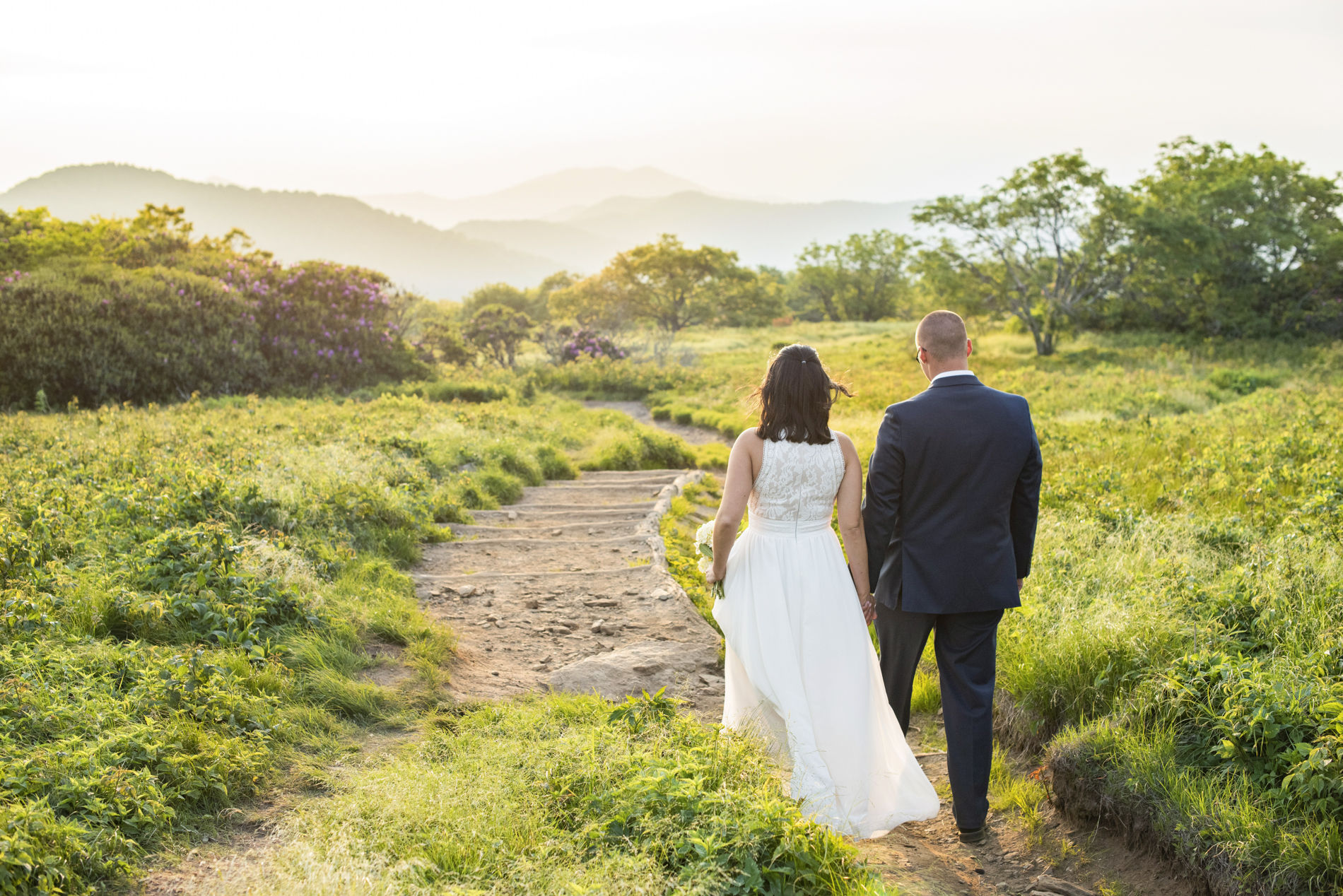 Couple walking at sunset atop Craggy Gardens Wedding Photos