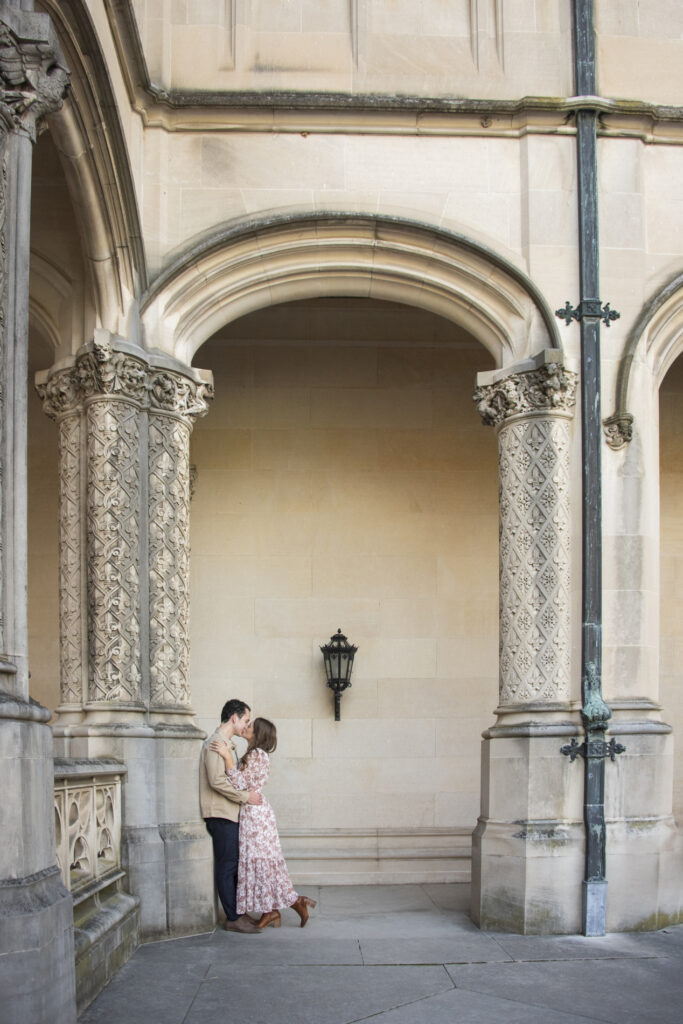 Couple kissing under arch at Biltmore Estate Engagement Photography