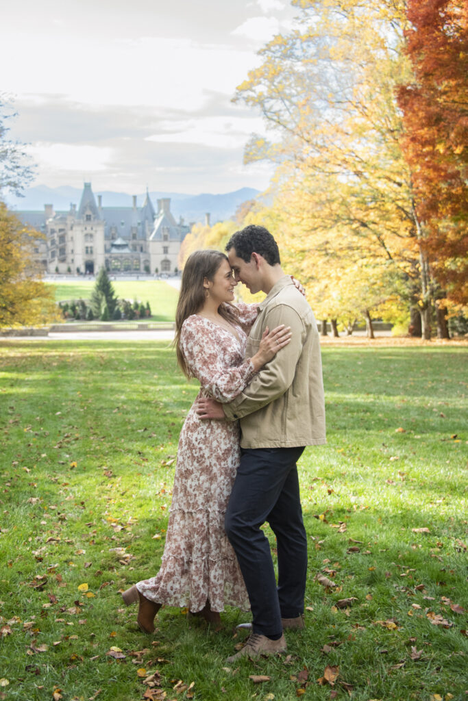 Couple snuggling during fall Engagement Photography at Biltmore Estate