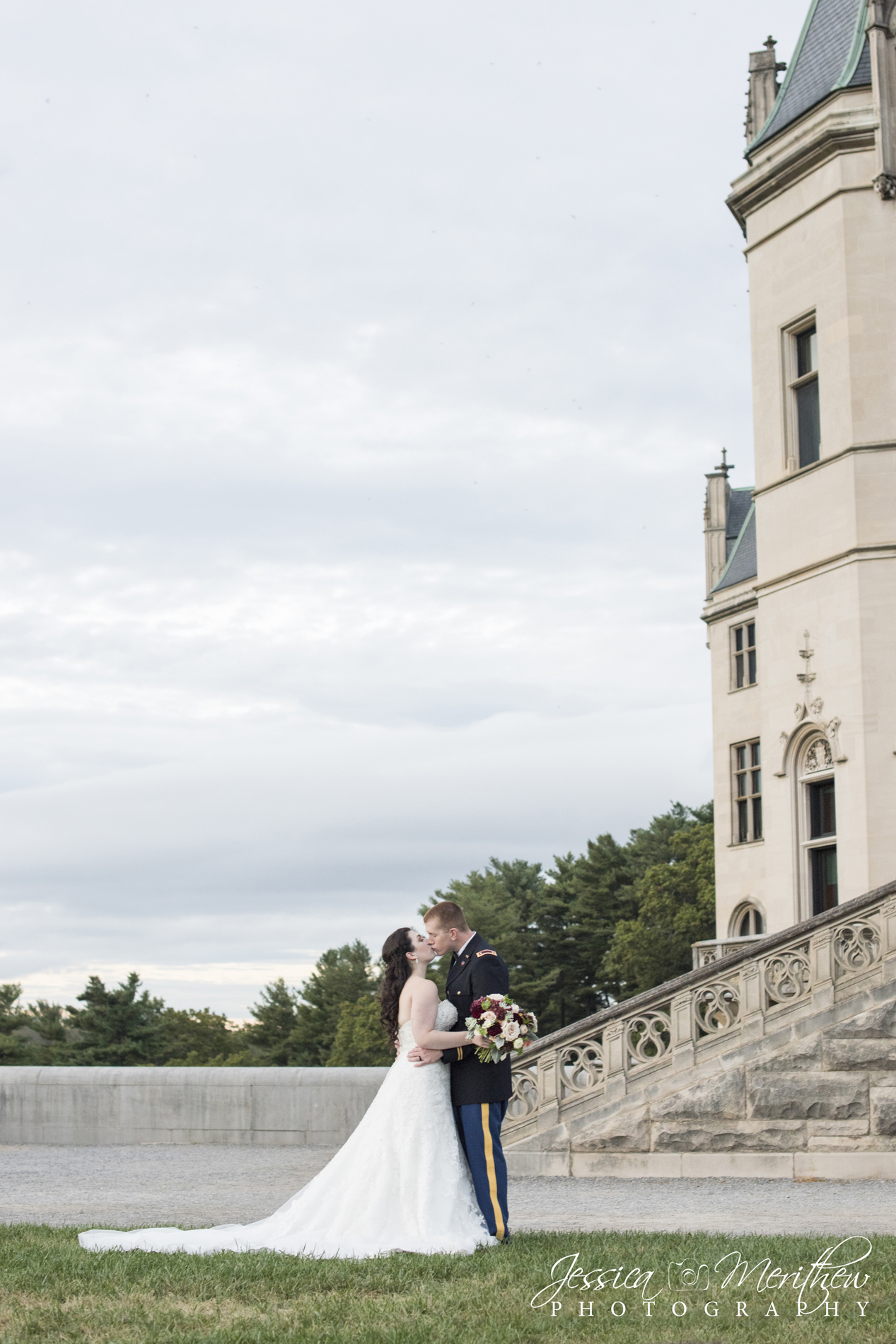 Couple kissing at Biltmore Estate during wedding