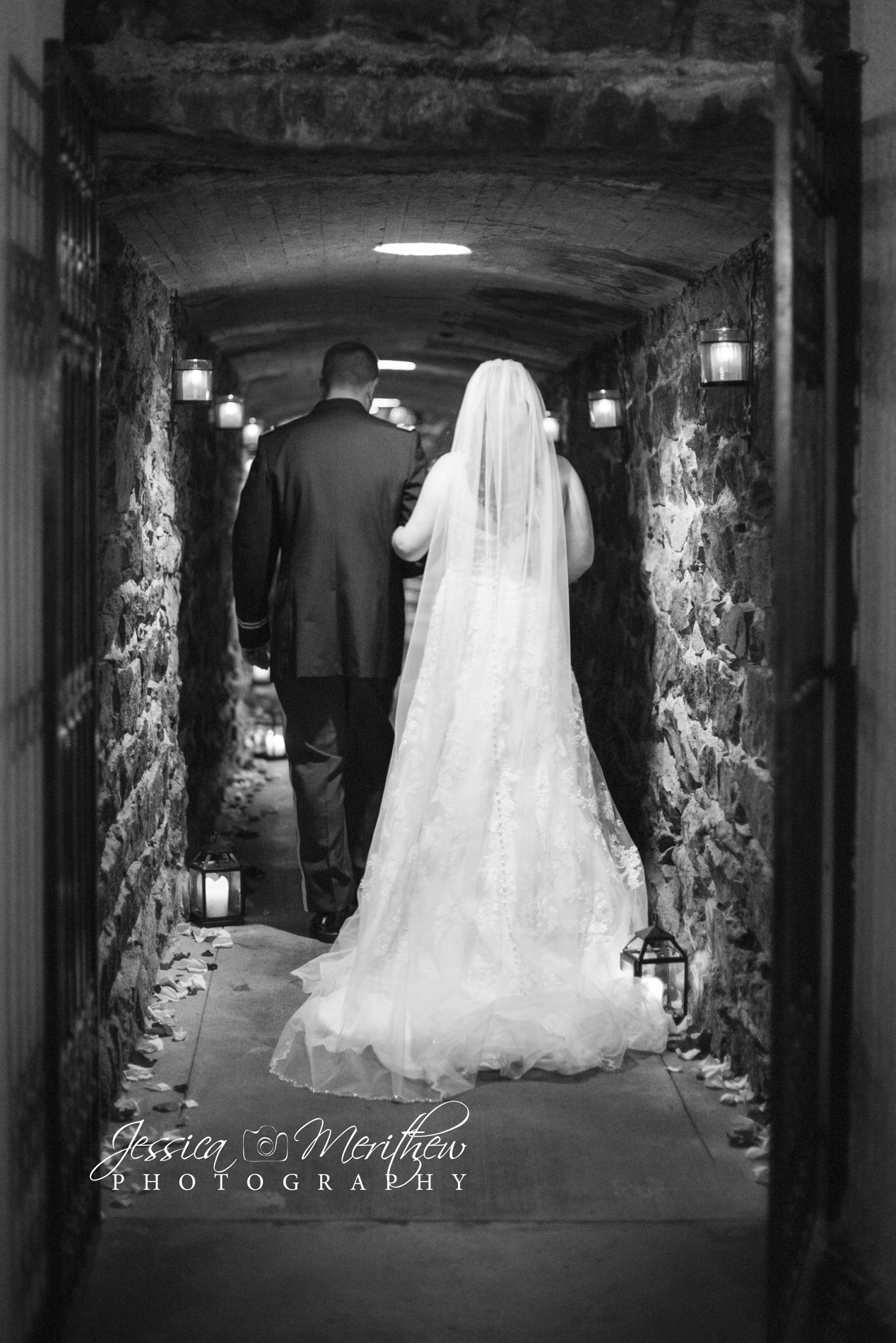 Couple walking out of Biltmore Estate champagne cellar wedding