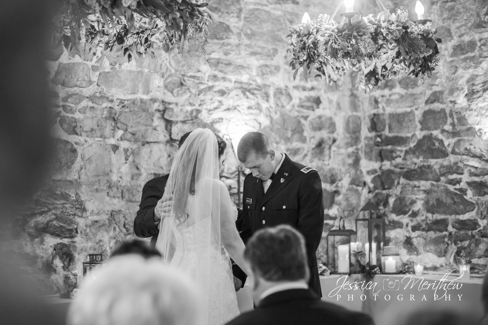 Couple praying during wedding ceremony