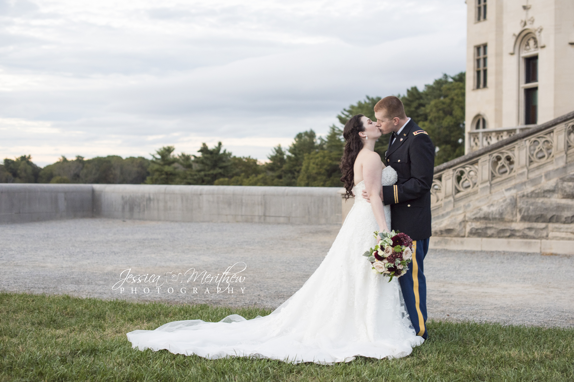 Biltmore Estate wedding photography with couple kissing on south terrace