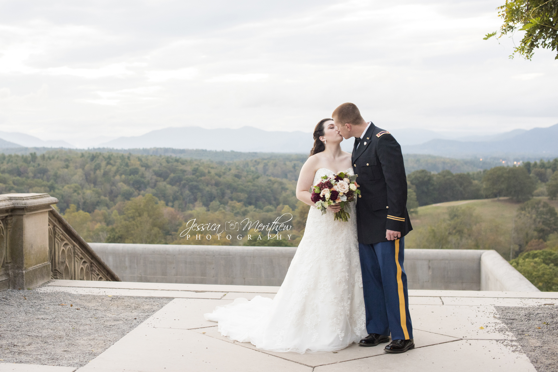 Biltmore Estate wedding photography with couple kissing on south terrace