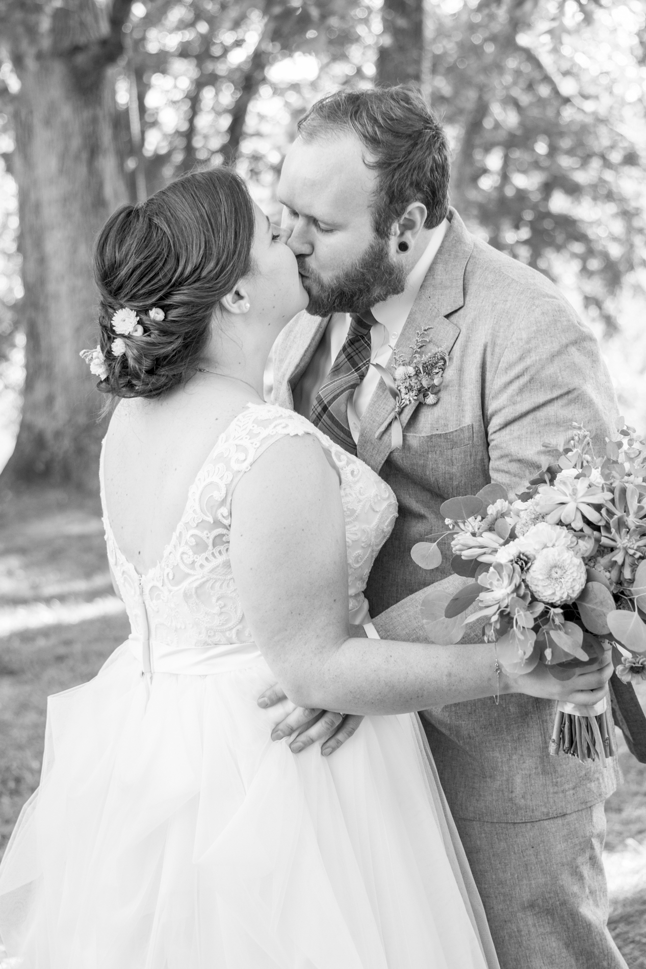 Yesterday Spaces Asheville wedding with couple kissing