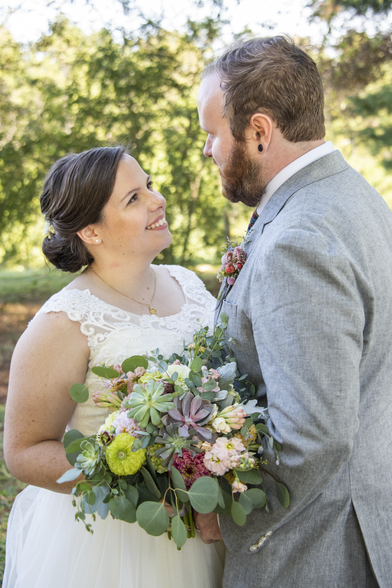 Couple looking at one another at wedding at Yesterday Spaces Asheville