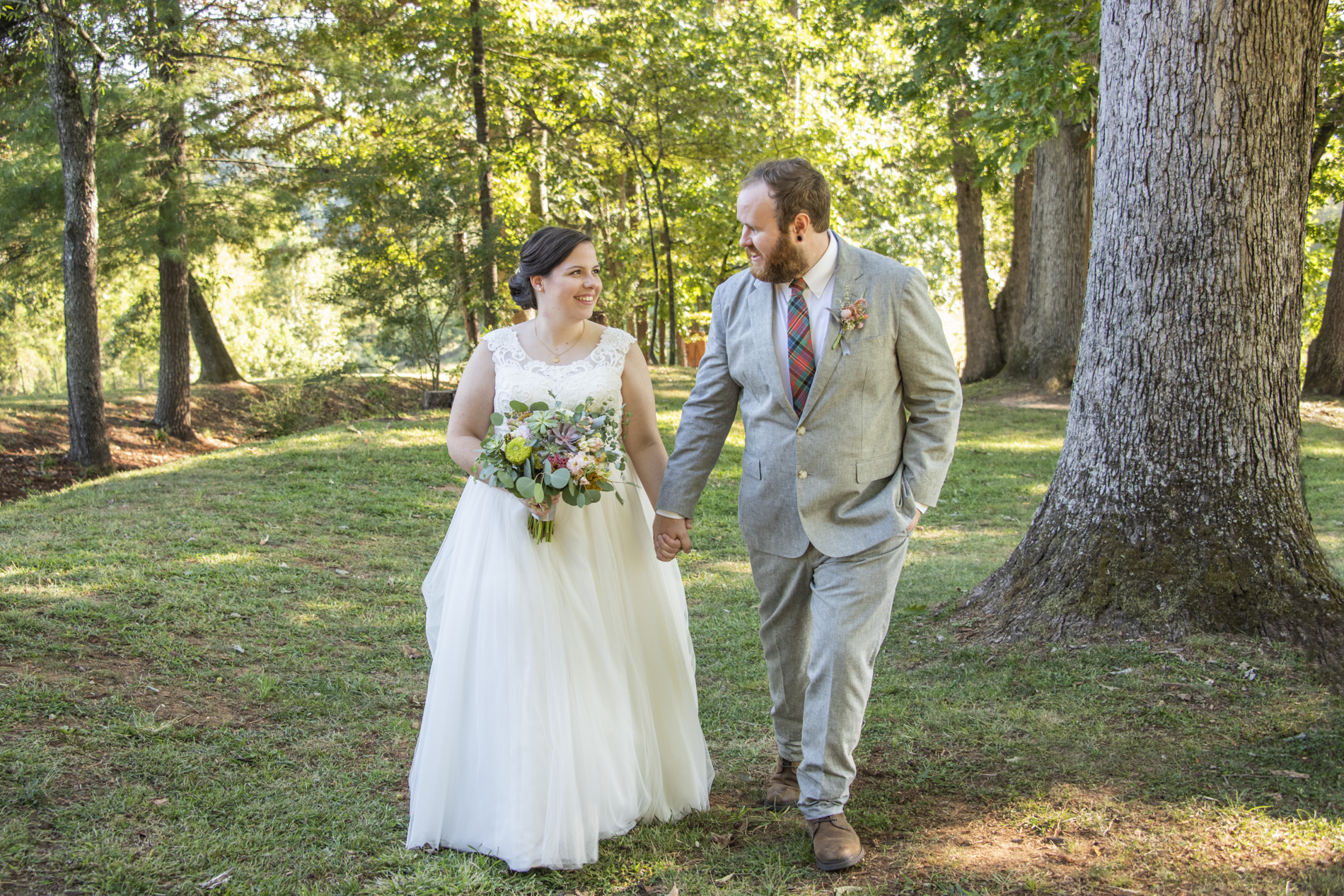 Couple walking together at wedding at Yesterday Spaces Asheville