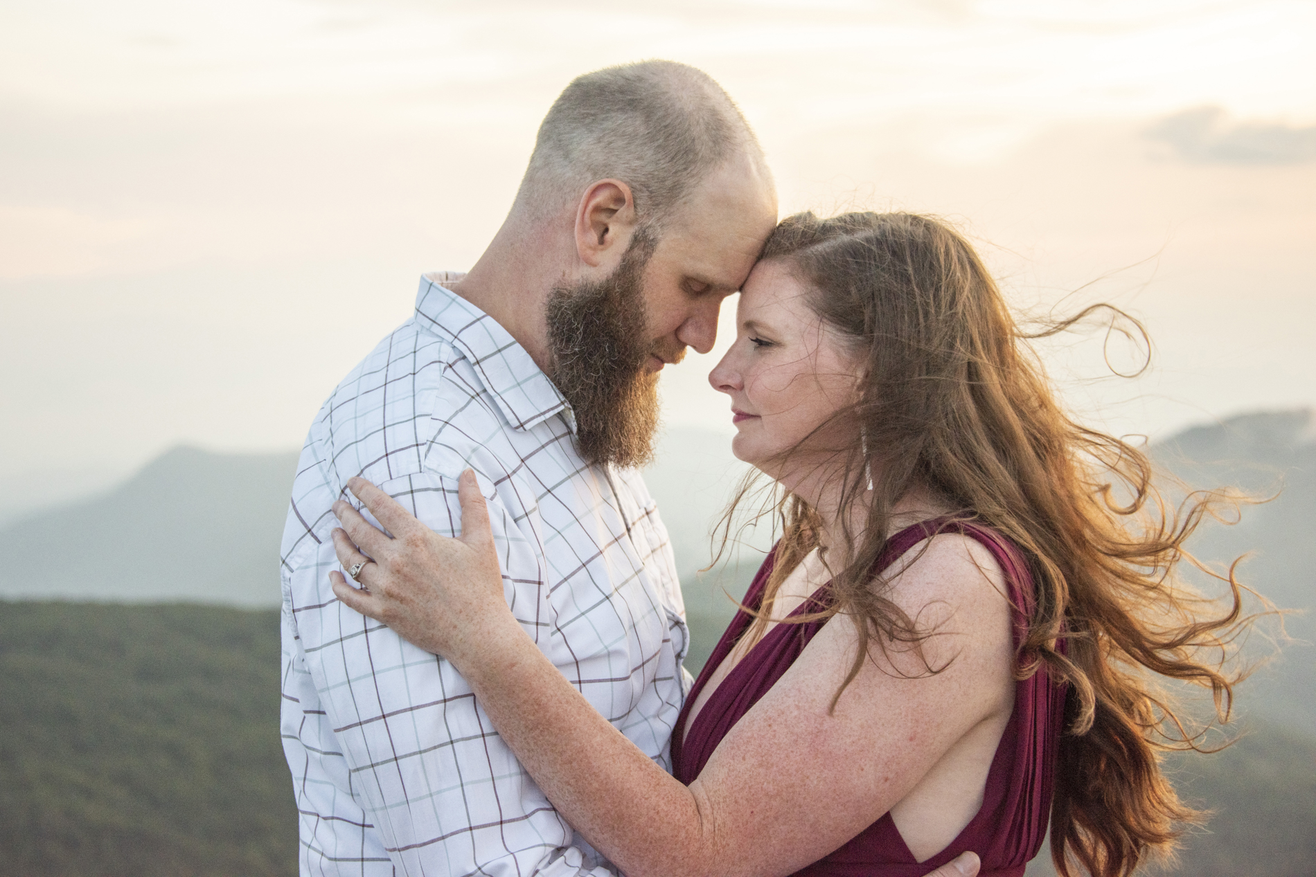 Craggy Gardens Engagement Photo of couple snuggling