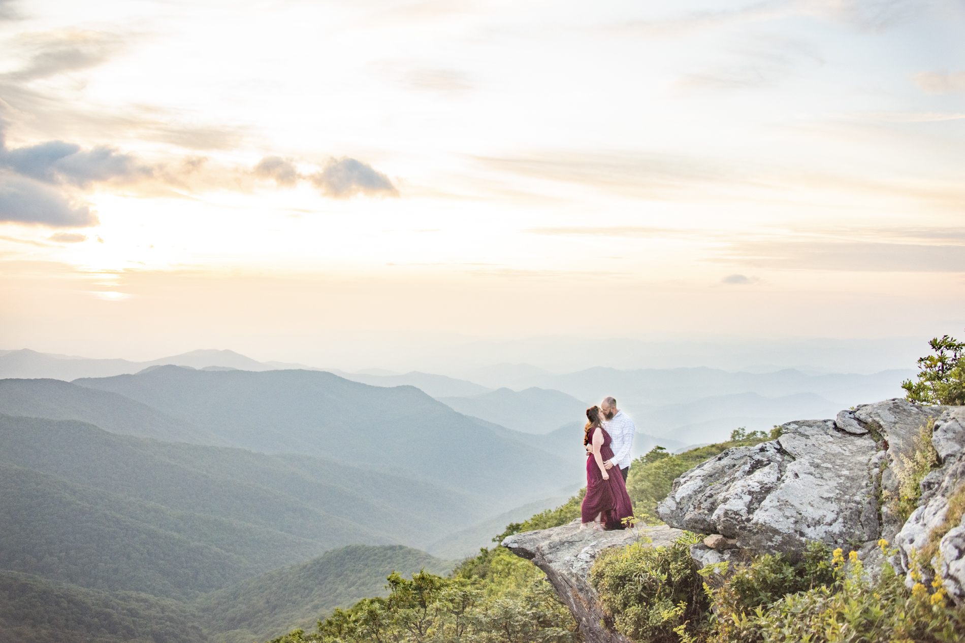 Craggy Gardens Engagement Photos of couple kissing with mountain views