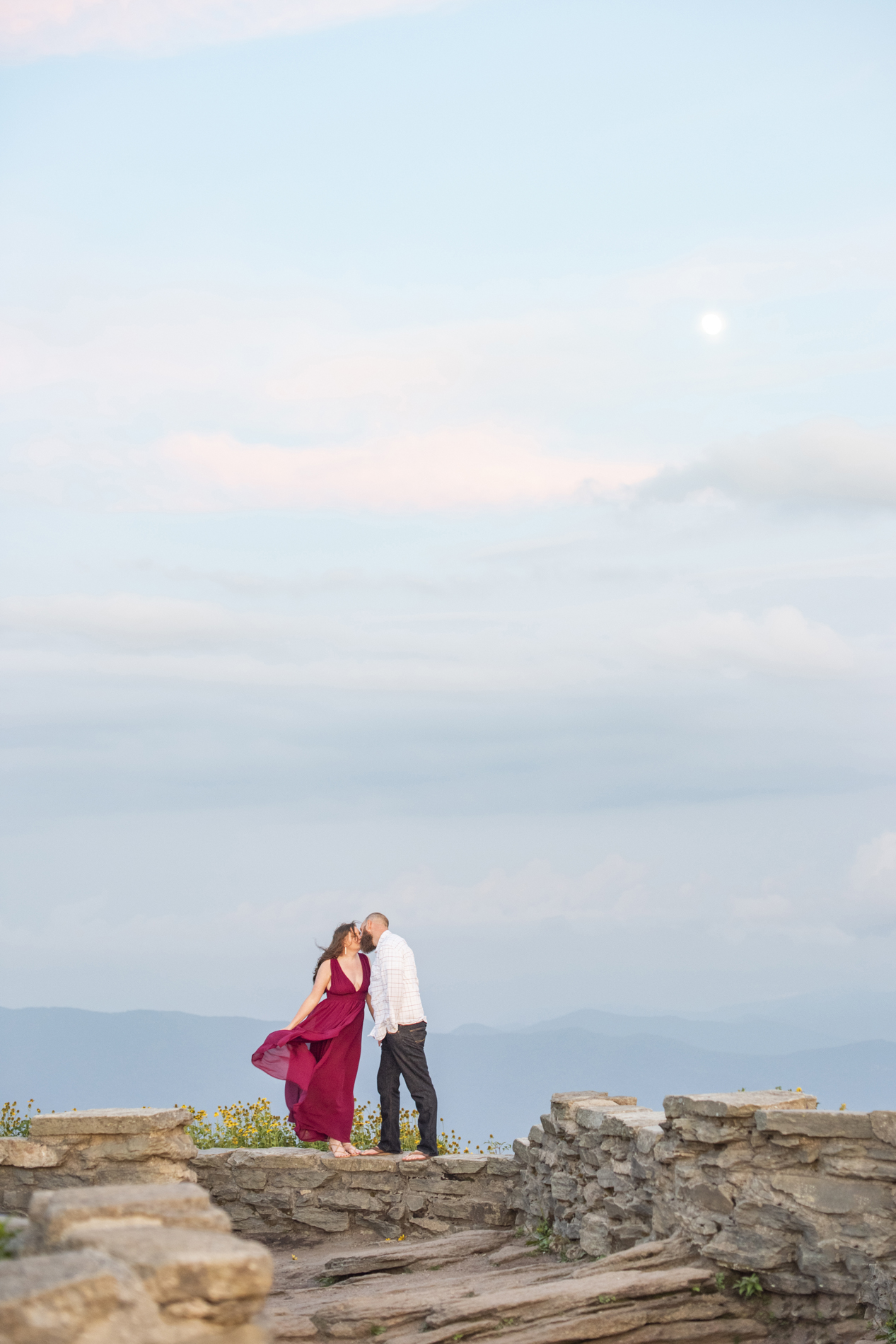 Craggy Gardens Engagement Photos of couple kissing with mountain views