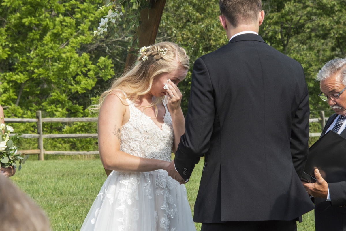 Bride crying during wedding ceremony