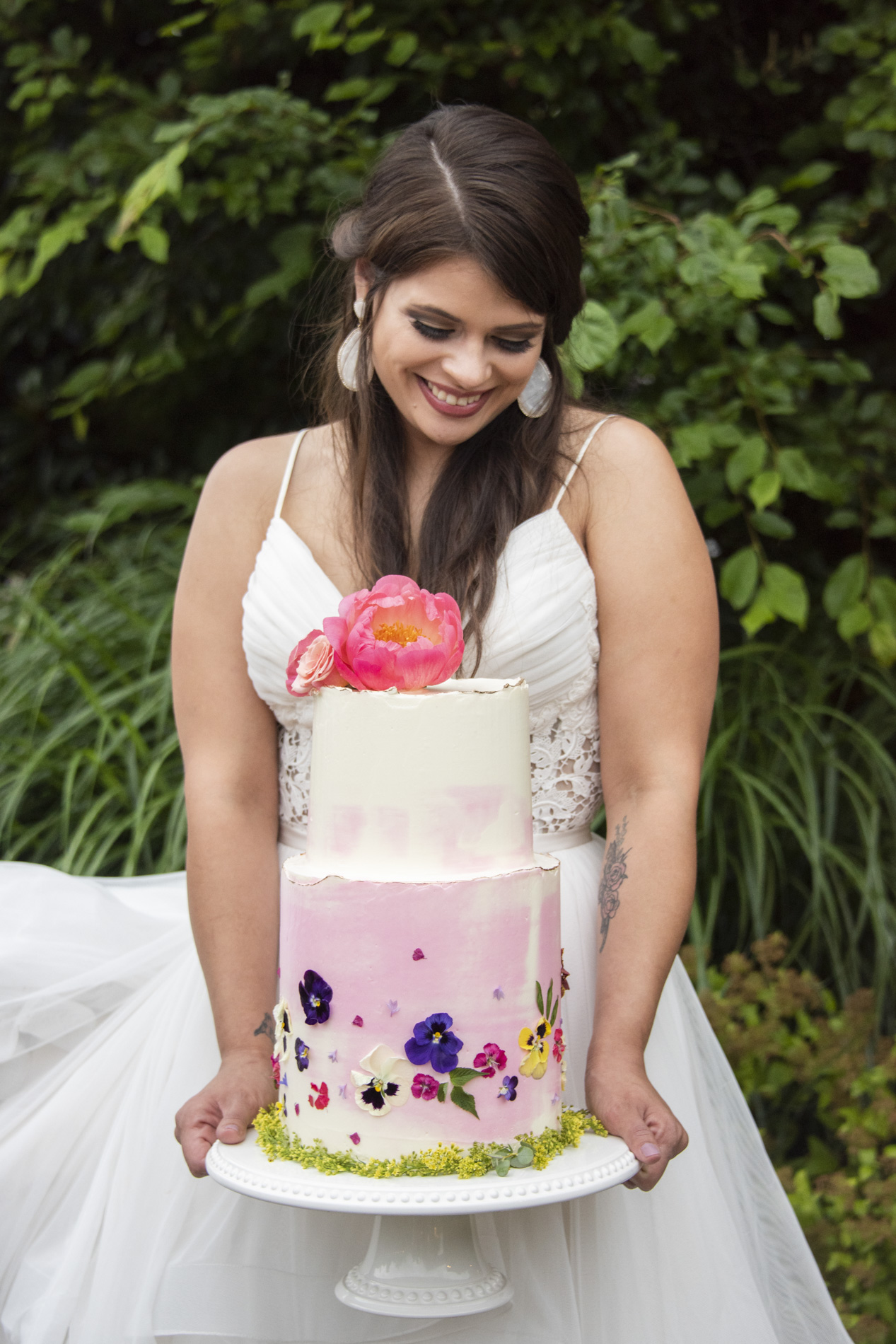 Bride holding cake at Haiku wedding in Asheville