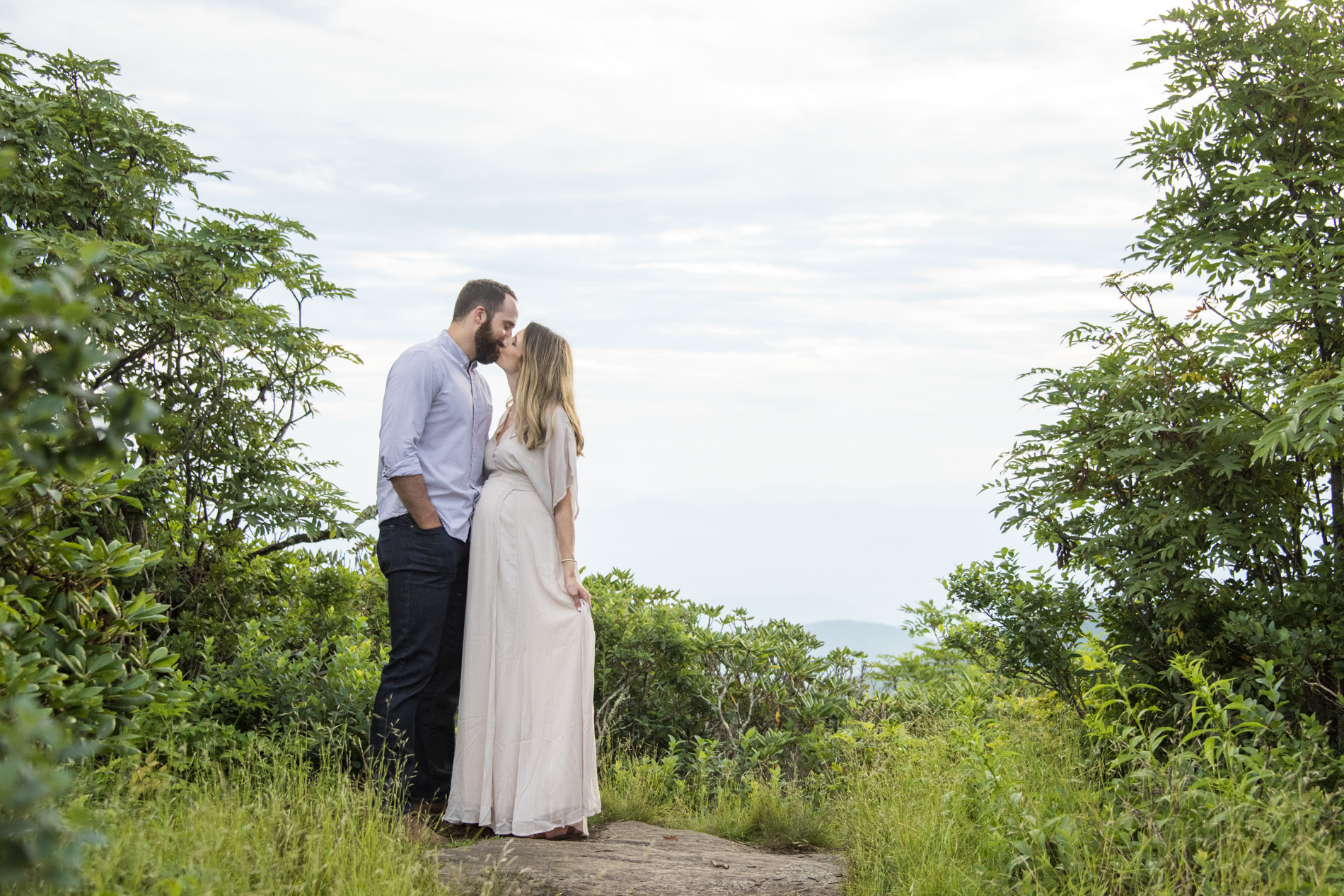 Couple kissing during photos in Asheville