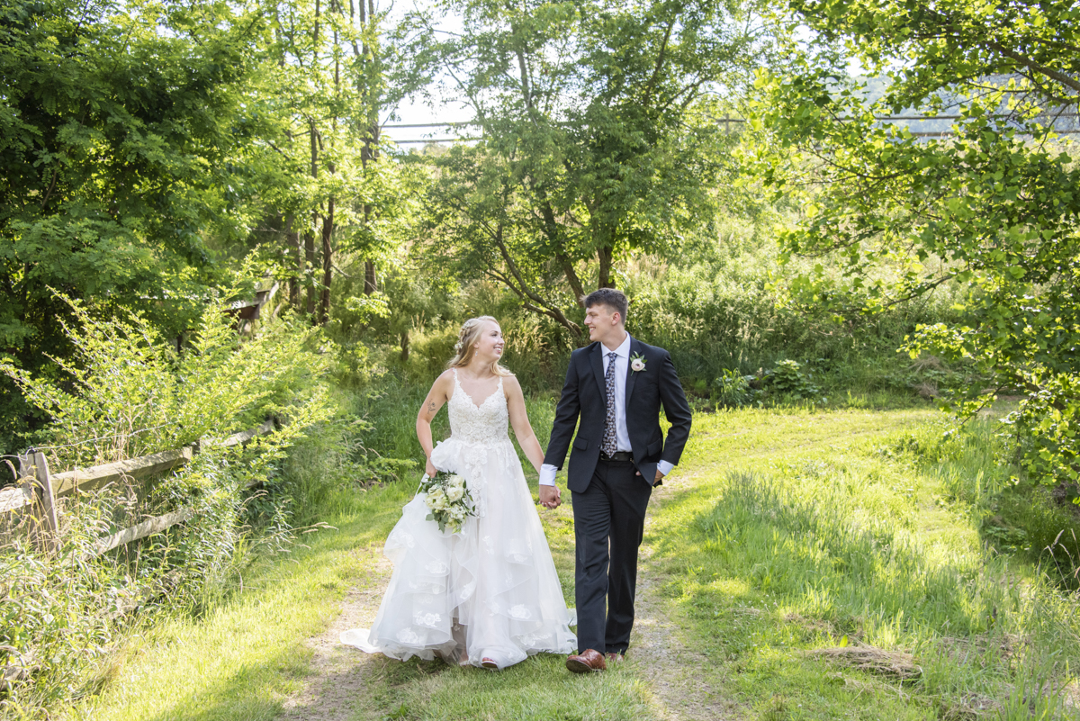 Couple walking at Claxton Farm Wedding