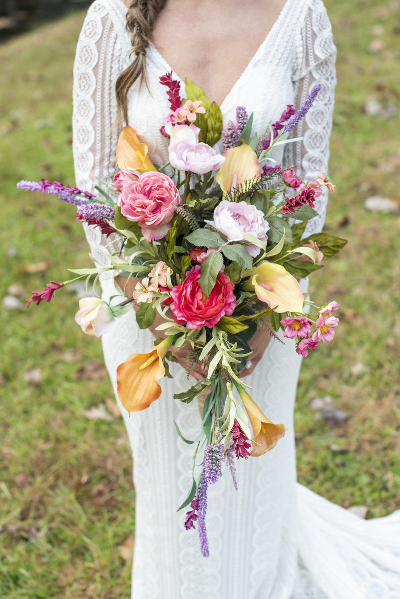 Bride holding fall wedding bouquet