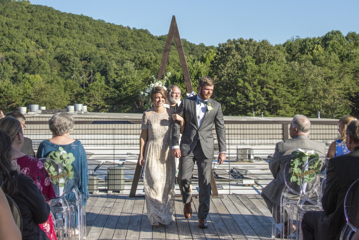 Couple walking down aisle at Highland Brewing Wedding