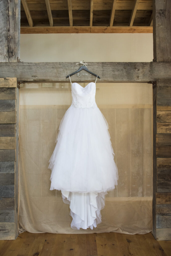 Wedding dress hanging at Timber Hall Events Wedding Photography