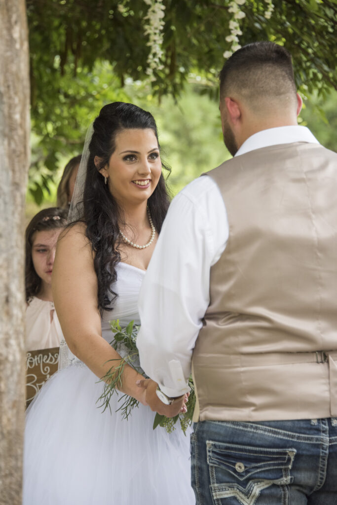 Bride smiling during wedding ceremony