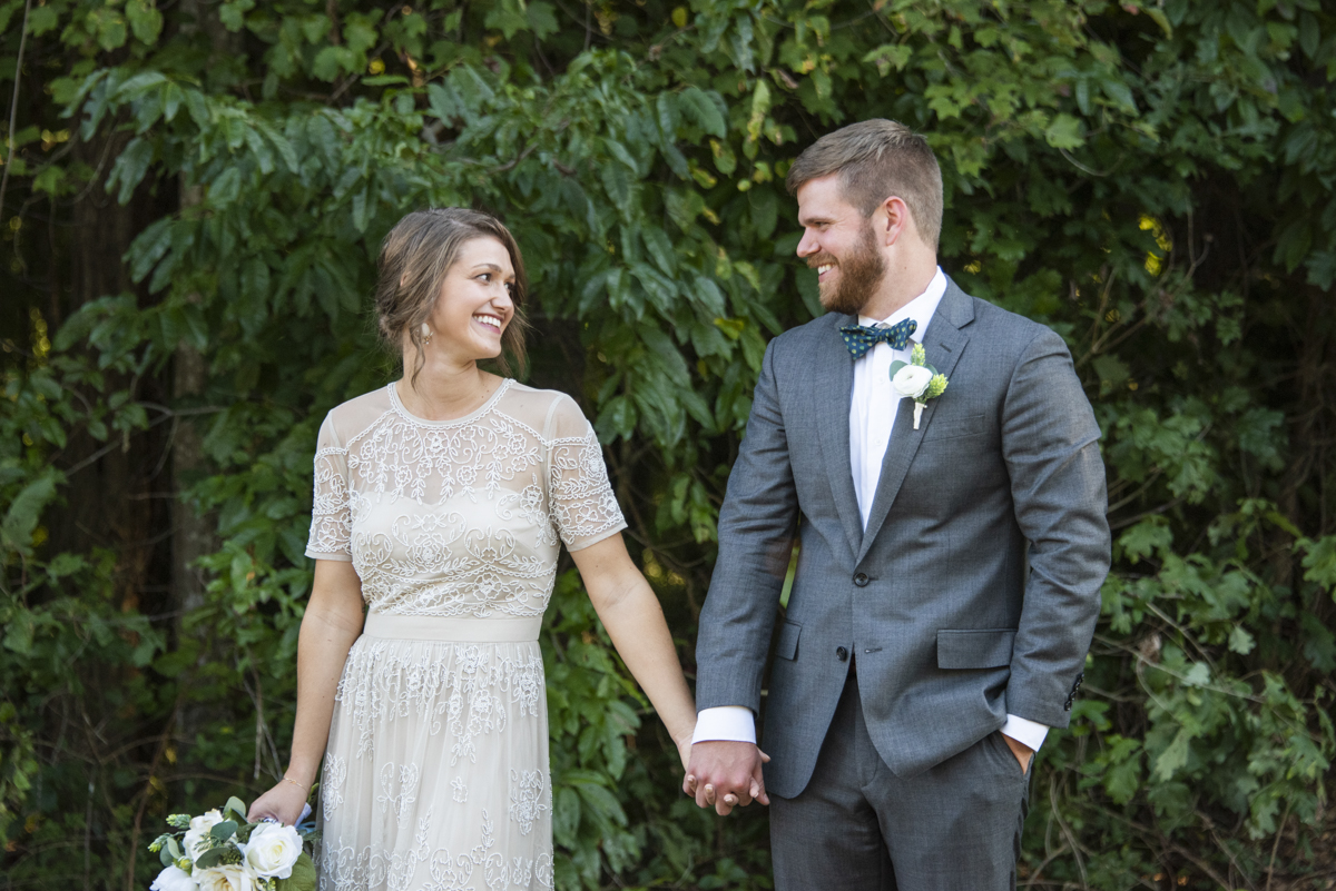 Couple smiling and holding hands