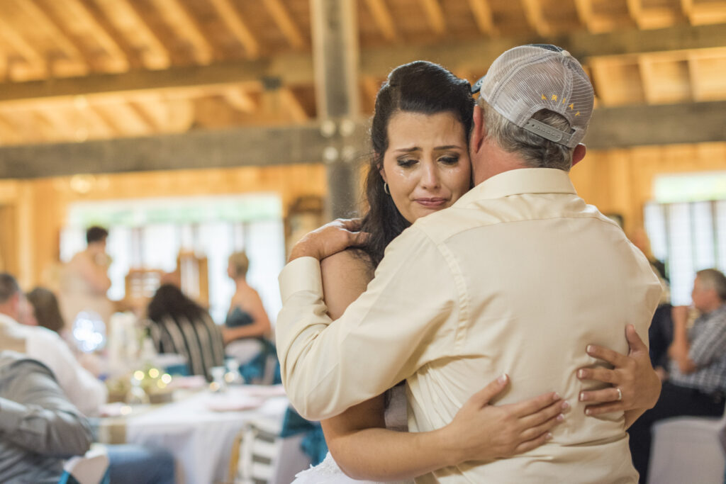 Bride crying while dancing with father at Timber Hall Events Wedding Photography