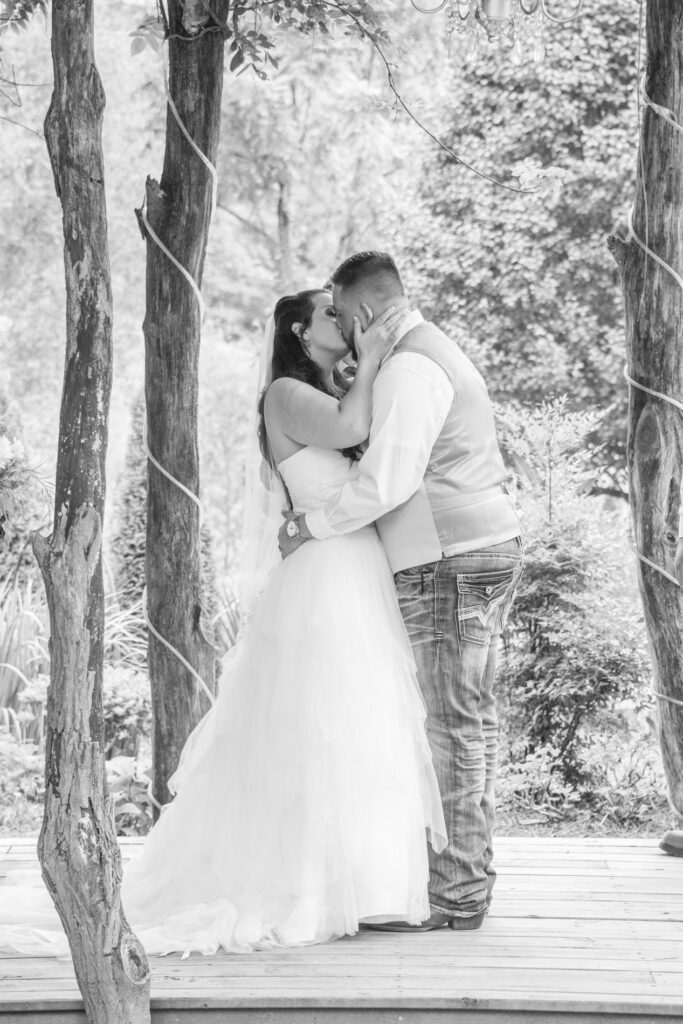 First kiss at wedding at Timber Hall Events Wedding Photography