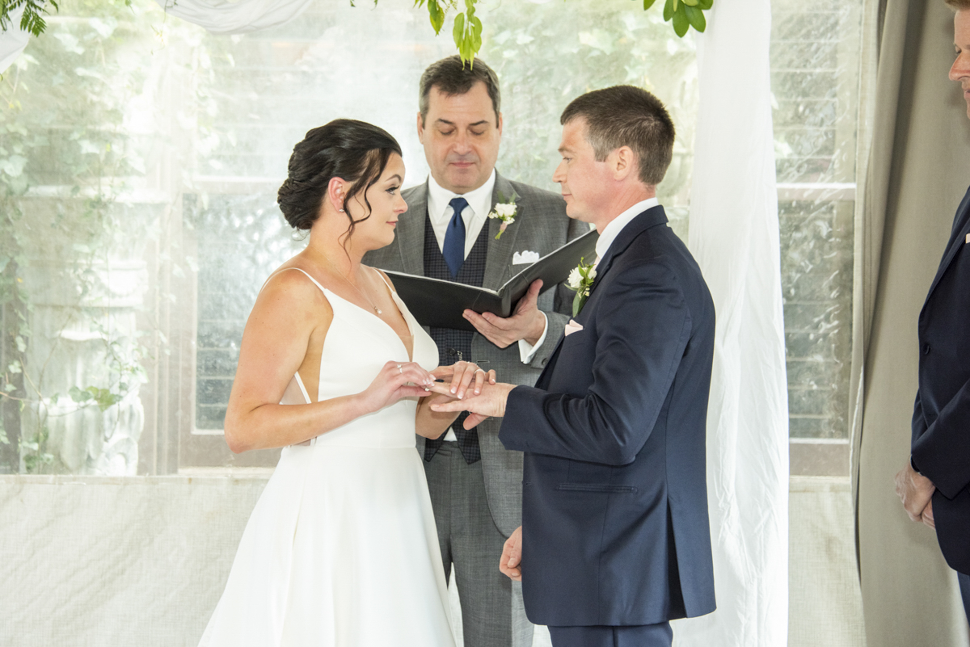 Couple exchanging rings at ceremony at Grand Bohemian Asheville Wedding