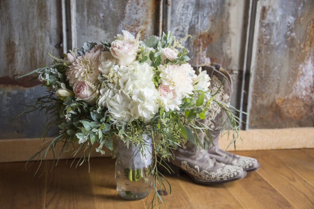 Timber Hall Events Wedding Photography of wedding bouquet and bride's boots