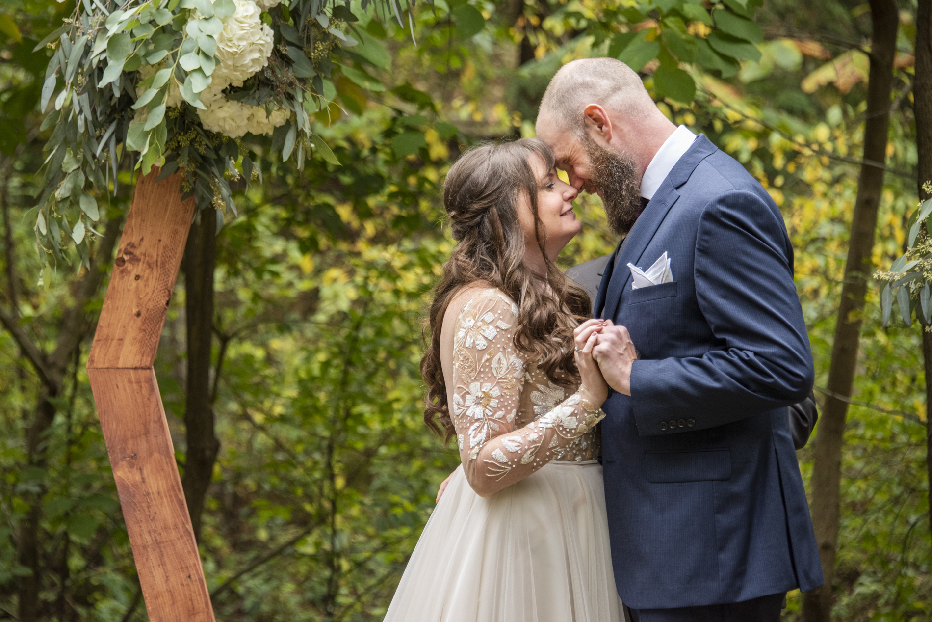 Couple smiling at Asheville botanical gardens wedding