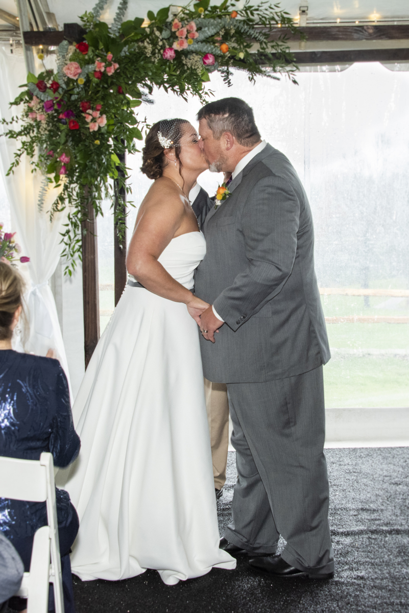 Couple's first kiss at Connestee Falls Wedding