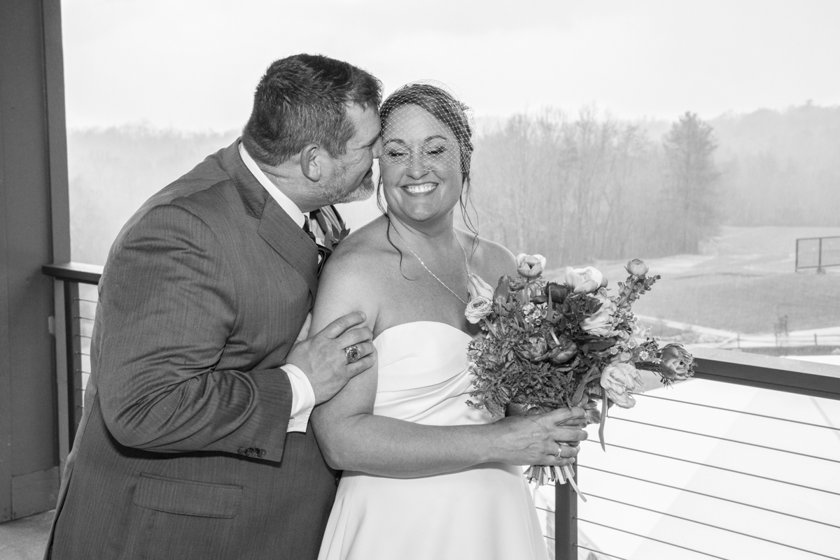 Couple snuggling at Connestee Falls Wedding