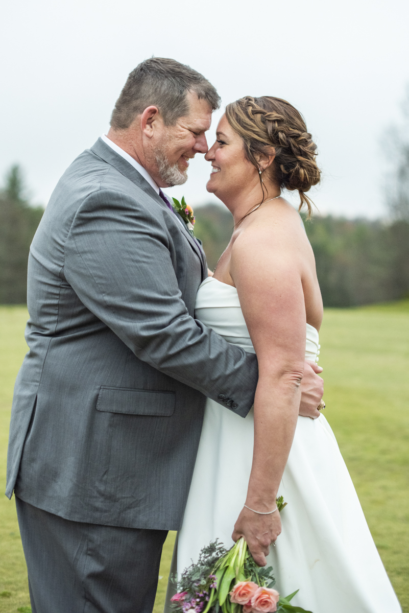 Couple touching noses at Connestee Falls Wedding