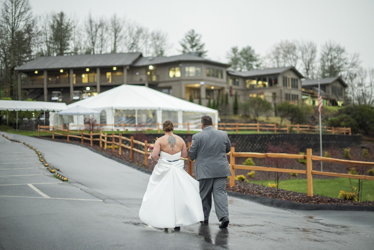 Couple walking to reception at Connestee Falls Wedding