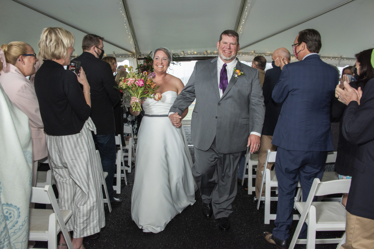 Couple walking down aisle at Connestee Falls Wedding